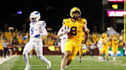 Aug 28, 2025; Minneapolis, Minnesota, USA; Minnesota Golden Gophers wide receiver Jalen Smith (8) runs the ball after a catch for a touchdown against the Buffalo Bulls during the second half of the game at Huntington Bank Stadium. Mandatory Credit: Matt Krohn-Imagn Images