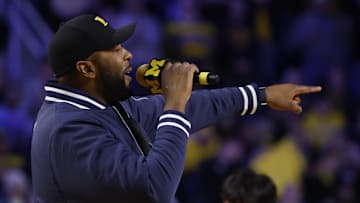Dec 7, 2024; Ann Arbor, Michigan, USA;  Michigan Wolverines head coach football Sherrone Moore addresses the crowd during a basketball game against the Iowa Hawkeyes at Crisler Center. Mandatory Credit: Rick Osentoski-Imagn Images