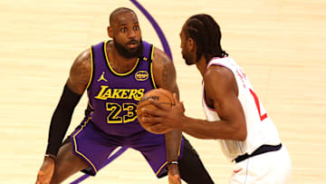 Feb 28, 2025; Los Angeles, California, USA; Los Angeles Lakers forward LeBron James (23) defends LA Clippers forward Kawhi Leonard (2) during the first quarter at Crypto.com Arena. Mandatory Credit: Jason Parkhurst-Imagn Images