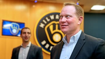 Milwaukee Brewers general manager Matt Arnold, right, mingles with others following a press conference.
