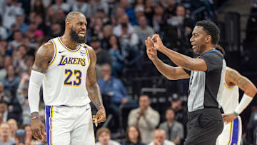 Los Angeles Lakers forward LeBron James talks with a referee against the Minnesota Timberwolves during the 2025 NBA Playoffs