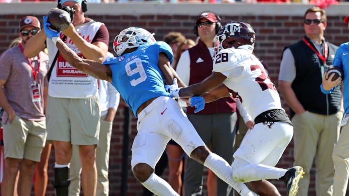 Nov 4, 2023; Oxford, Mississippi, USA; Mississippi Rebels wide receiver Tre Harris (9) makes a one handed catch over Texas A&M Aggies defensive back Josh DeBerry (28) during the second half at Vaught-Hemingway Stadium. Mandatory Credit: Petre Thomas-USA TODAY Sports