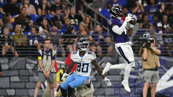 Aug 11, 2022; Baltimore, Maryland, USA; Baltimore Ravens cornerback Daryl Worley  (41) intercepts a pass intended for Tennessee Titans wide receiver Terry Godwin (80) during the second half at M&T Bank Stadium. Mandatory Credit: Tommy Gilligan-USA TODAY Sports