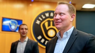 Matt Arnold, right, mingles with others following a press conference where it was announced that he would be taking over the role as president of baseball operations for the Milwaukee Brewers on, October 27, 2022. David Stearns, left, who joined the organization in October 2015 as general manager and was named president of baseball operations prior to the 2019 season, said he would be stepping down.