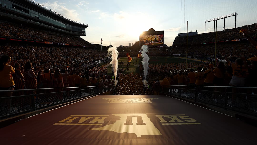 Aug 28, 2025; Minneapolis, Minnesota, USA; Minnesota Golden Gophers players take the field before the game against the Buffalo Bulls at Huntington Bank Stadium. Mandatory Credit: Matt Krohn-Imagn Images