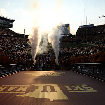 Aug 28, 2025; Minneapolis, Minnesota, USA; Minnesota Golden Gophers players take the field before the game against the Buffalo Bulls at Huntington Bank Stadium. Mandatory Credit: Matt Krohn-Imagn Images