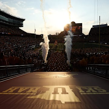 Aug 28, 2025; Minneapolis, Minnesota, USA; Minnesota Golden Gophers players take the field before the game against the Buffalo Bulls at Huntington Bank Stadium. Mandatory Credit: Matt Krohn-Imagn Images