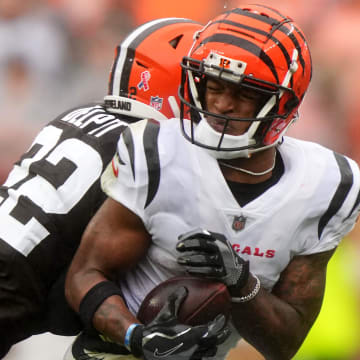 Cincinnati Bengals wide receiver Ja'Marr Chase (1) is hit by Cleveland Browns safety Grant Delpit (22) after a catch in the third quarter of an NFL football game between the Cincinnati Bengals and Cleveland Browns, Sunday, Sept. 10, 2023, at Cleveland Browns Stadium in Cleveland.