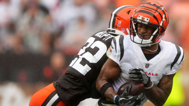 Cincinnati Bengals wide receiver Ja'Marr Chase (1) is hit by Cleveland Browns safety Grant Delpit (22) after a catch in the third quarter of an NFL football game between the Cincinnati Bengals and Cleveland Browns, Sunday, Sept. 10, 2023, at Cleveland Browns Stadium in Cleveland.