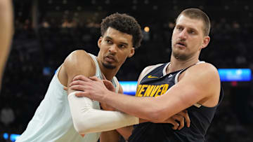 Jan 4, 2025; San Antonio, Texas, USA; San Antonio Spurs center Victor Wembanyama (1) and Denver Nuggets center Nikola Jokic (15) battle for position during an inbound pass in the second half at Frost Bank Center.