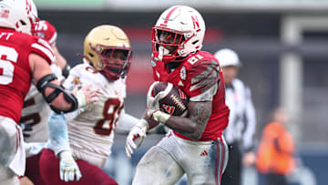 Nebraska running back Emmett Johnson carries the ball during the 2024 Pinstripe Bowl.
