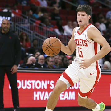 Oct 6, 2025; Houston, Texas, USA; Houston Rockets guard Reed Sheppard (15) dribbles the ball during the game against the Atlanta Hawks at Toyota Center. Mandatory Credit: Troy Taormina-Imagn Images