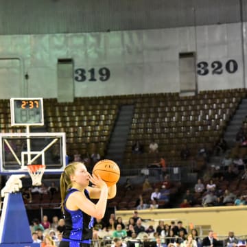 A Lomega High School (Oklahoma) player releases a shot in Jim Norick Arena in Oklahoma City, also known as "the Big House," the venue for all Oklahoma state high school basketball championships in 2024-25.
