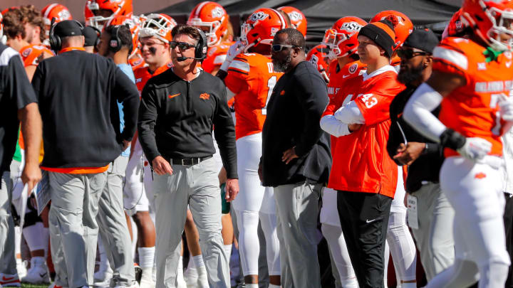 Oct 14, 2023; Stillwater, Oklahoma, USA; Oklahoma State Cowboys head coach Mike Gundy stands on the sidelines in the first quarter against the Kansas Jayhawks at Boone Pickens Stadium. Mandatory Credit: Nathan J. Fish-USA TODAY Sports