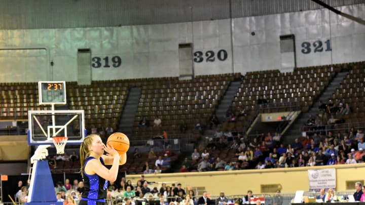 A Lomega High School (Oklahoma) player releases a shot in Jim Norick Arena in Oklahoma City, also known as "the Big House," the venue for all Oklahoma state high school basketball championships in 2024-25.