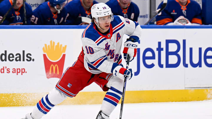 New York Rangers left wing Artemi Panarin skates across the blue against the New York Islanders. New York Rangers left wing Artemi Panarin skates across the blue against the New York Islanders.
