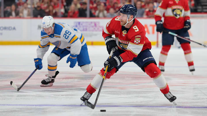 Dec 20, 2025; Sunrise, Florida, USA; Florida Panthers center Sam Bennett (9) moves the puck against the St. Louis Blues during the second period at Amerant Bank Arena. Mandatory Credit: Sam Navarro-Imagn Images