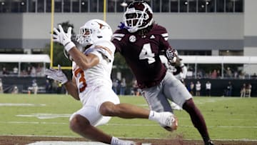 Oct 25, 2025; Starkville, Mississippi, USA; Texas Longhorns wide receiver Emmett Mosley V (3) catches the ball for a touchdown as Mississippi State Bulldogs defensive back DeAgo Brumfield (4) defends during the fourth quarter at Davis Wade Stadium at Scott Field. Mandatory Credit: Petre Thomas-Imagn Images