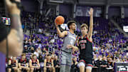 Jan. 15, 2025-TCU's Brendan Wenzel (0) tries to pass around Utah's Jake Whalin (10) in the Schollmaier Arena. 