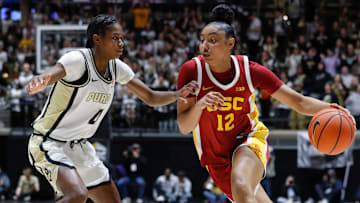 Purdue Boilermakers guard Destini Lombard (4) defends USC Trojans guard JuJu Watkins (12) Wednesday, Jan. 22, 2025, during the NCAA women’s basketball game at Mackey Arena in West Lafayette, Ind. USC Trojans won 79-37.