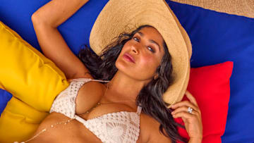 Salma Hayek Pinault was photographed by Ruven Afanador. Swimsuit by Sara Cristina. Hat by Janessa Leoné. Body chain by Jacquie Aiche.