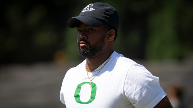 Oregon running backs coach Ra'Shaad Samples works with the team during the Ducks’ fall camp Tuesday, Aug. 6, 2024, at the Hat