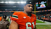 Nov 15, 2025; Miami Gardens, Florida, USA; Miami Hurricanes offensive lineman Francis Mauigoa (61) looks on after the game against NC State Wolfpack at Hard Rock Stadium. Mandatory Credit: Sam Navarro-Imagn Images
