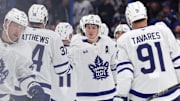 Apr 9, 2025; Tampa, Florida, USA;Toronto Maple Leafs right wing Mitch Marner (16), center Auston Matthews (34) and teammates celebrate after they defeated the Tampa Bay Lightning at Amalie Arena. Mandatory Credit: Kim Klement Neitzel-Imagn Images