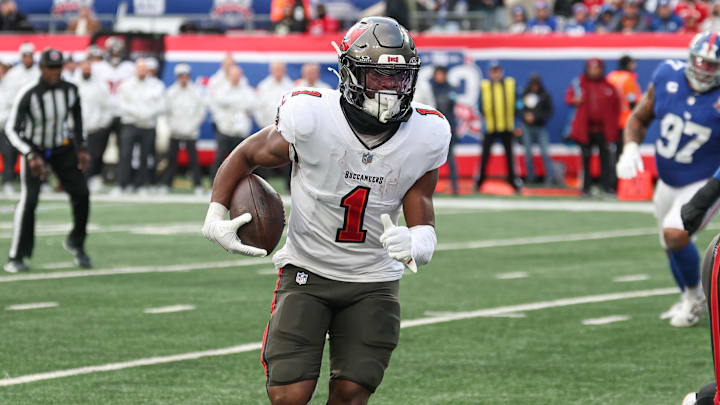 Nov 24, 2024; East Rutherford, New Jersey, USA; Tampa Bay Buccaneers running back Rachaad White (1) scores a rushing touchdown during the second half against the New York Giants at MetLife Stadium. Mandatory Credit: Vincent Carchietta-Imagn Images Nov 24, 2024; East Rutherford, New Jersey, USA; Tampa Bay Buccaneers running back Rachaad White (1) scores a rushing touchdown during the second half against the New York Giants at MetLife Stadium. Mandatory Credit: Vincent Carchietta-Imagn Images