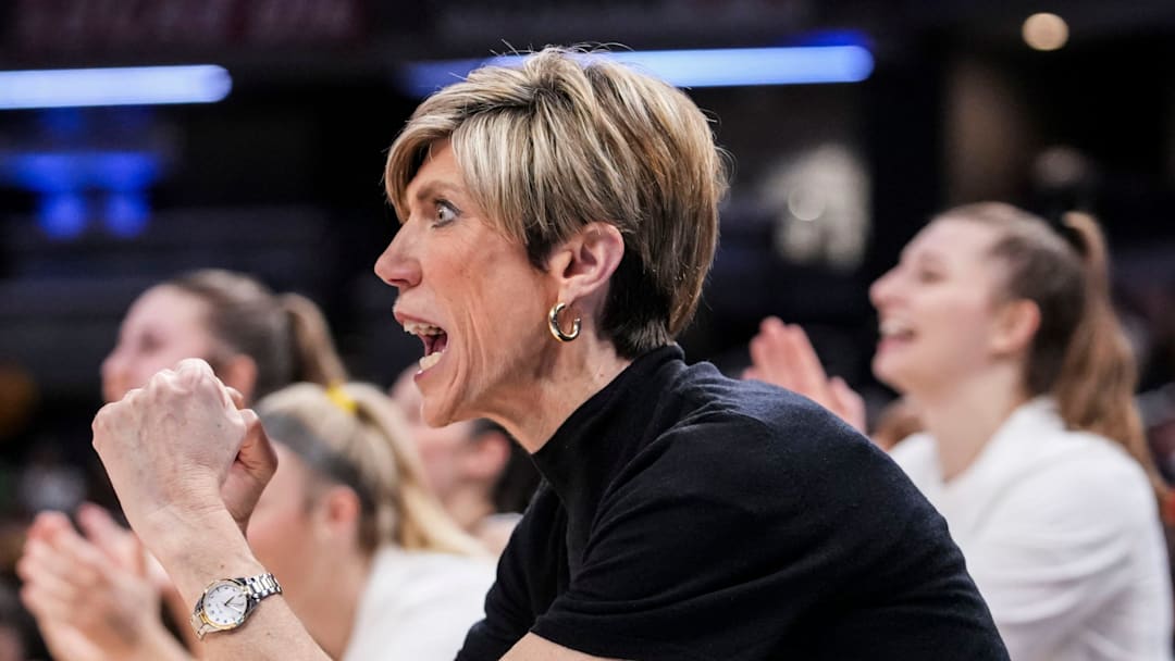 Iowa Hawkeyes head coach Jan Jensen celebrates Friday, March 6, 2026, during a Big Ten women's basketball tournament game at Gainbridge Fieldhouse in Indianapolis.