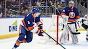 Apr 4, 2025; Elmont, New York, USA;  New York Islanders defenseman Noah Dobson (8) controls the puck in the first period against the Minnesota Wild at UBS Arena. Mandatory Credit: Wendell Cruz-Imagn Images