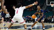 Nov 25, 2025; Las Vegas, Nevada, USA; Notre Dame Fighting Irish guard Markus Burton (3) dribbles the ball defended by Rutgers Scarlet Knights guard Jamichael Davis (1) during the second half in a 2025 Players Era Festival group play game at MGM Grand Garden Arena. Mandatory Credit: Stephen R. Sylvanie-Imagn Images