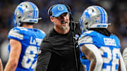 Detroit Lions head coach Dan Campbell shakes hands with running back Jahmyr Gibbs (26) after Sam LaPorta's touchdown against Tennessee Titans during the first half at Ford Field in Detroit on Sunday, Oct. 27, 2024.