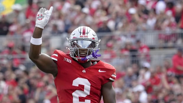 Ohio State Buckeyes safety Caleb Downs (2) celebrates after sacking Akron Zips quarterback Ben Finley (10)