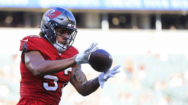 Tampa Bay Buccaneers linebacker Daniel Grzesiak (57) catches a pass during warmups before the game against the Bengals