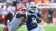 Sep 6, 2025; Durham, North Carolina, USA;  Illinois Fighting Illini linebacker Gabe Jacas (17) swats the ball from Duke Blue Devils quarterback Darian Mensah (10) during the second quarter at Wallace Wade Stadium. Mandatory Credit: Zachary Taft-Imagn Images