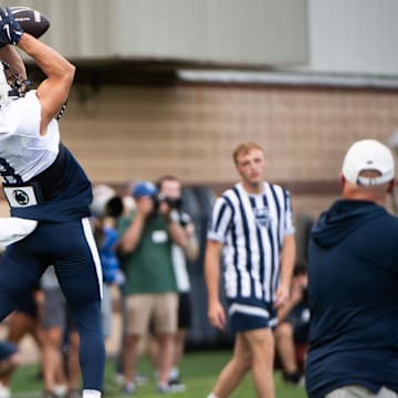 Penn State wide receiver Trebor Peña catches a pass in the end zone during practice outside Holuba Hall.