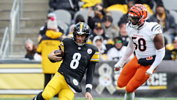 Nov 16, 2025; Pittsburgh, Pennsylvania, USA; Pittsburgh Steelers quarterback Aaron Rodgers (8) slides after a run against the Cincinnati Bengals during the first half at Acrisure Stadium. Mandatory Credit: Charles LeClaire-Imagn Images