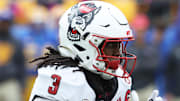 Oct 25, 2025; Pittsburgh, Pennsylvania, USA;  North Carolina State Wolfpack running back Hollywood Smothers (3) runs the ball against the Pittsburgh Panthers during the first quarter at Acrisure Stadium. Mandatory Credit: Charles LeClaire-Imagn Images