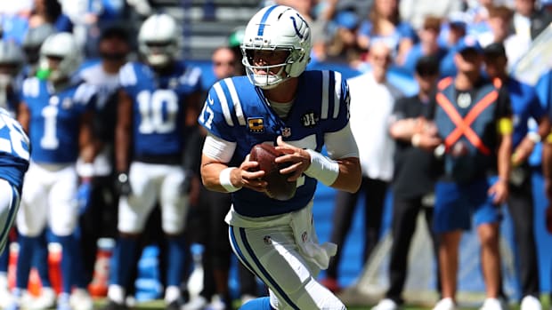 Indianapolis Colts quarterback Daniel Jones (17) rolls out during the first quarter against the Miami Dolphins.