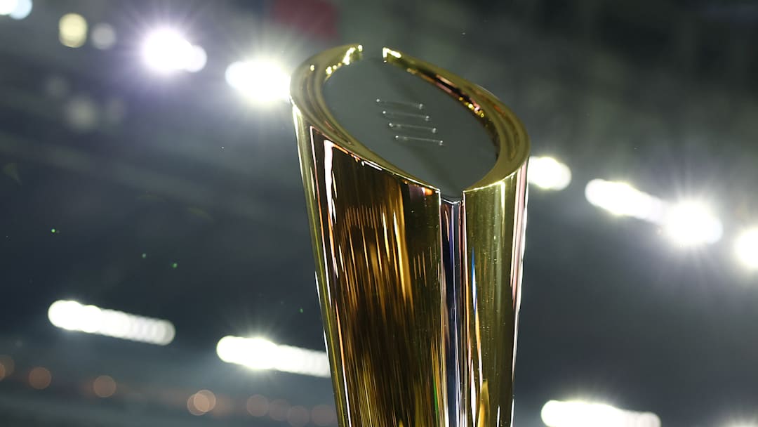 The CFP national championship trophy, as seen above during last year's title between Michigan and Washington, will be presented on Monday.