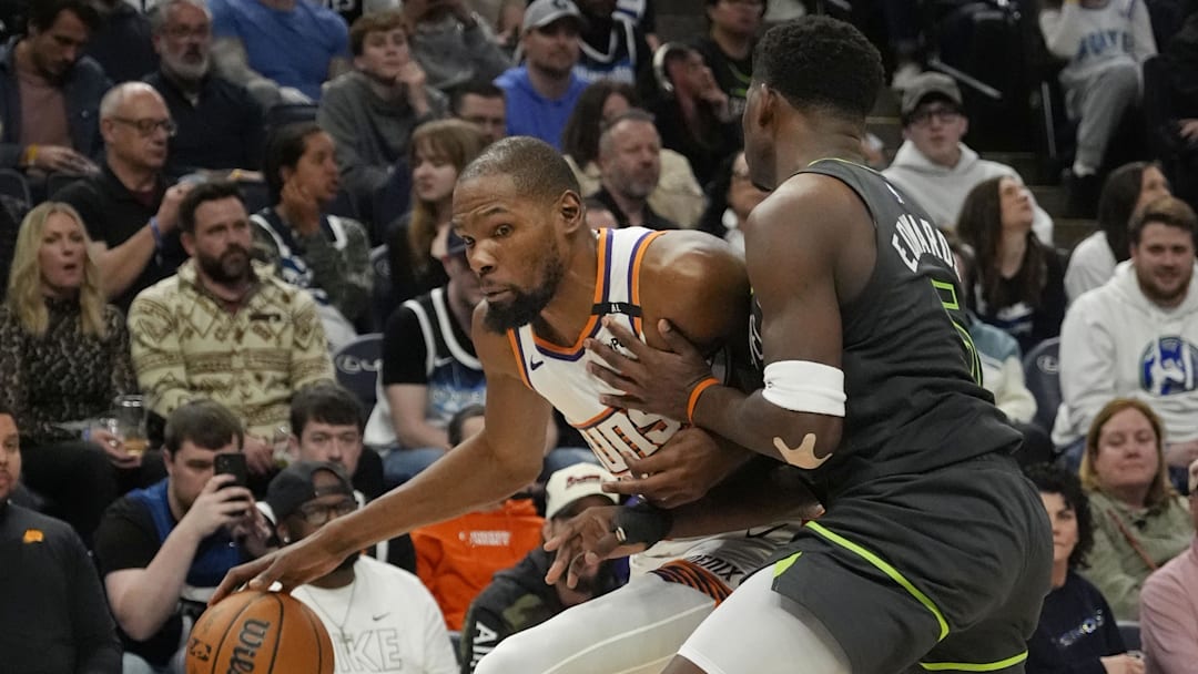 Mar 28, 2025; Minneapolis, Minnesota, USA; Phoenix Suns forward Kevin Durant (35) works around Minnesota Timberwolves guard Anthony Edwards (5) in the fourth quarter at Target Center. Mandatory Credit: Bruce Kluckhohn-Imagn Images Mar 28, 2025; Minneapolis, Minnesota, USA; Phoenix Suns forward Kevin Durant (35) works around Minnesota Timberwolves guard Anthony Edwards (5) in the fourth quarter at Target Center. Mandatory Credit: Bruce Kluckhohn-Imagn Images