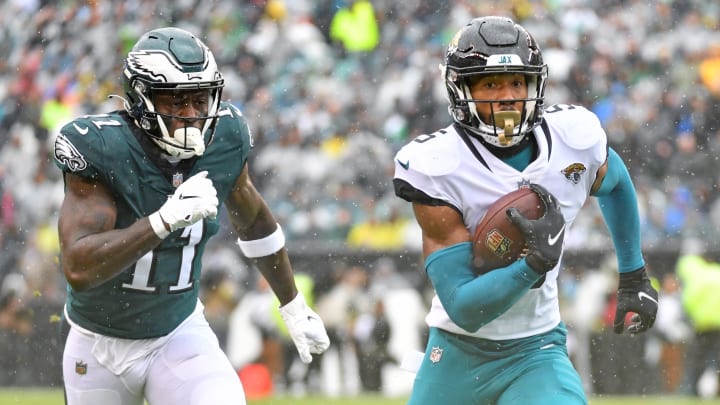 Oct 2, 2022; Philadelphia, Pennsylvania, USA; Jacksonville Jaguars safety Andre Cisco returns an interception for a touchdown past Philadelphia Eagles wide receiver A.J. Brown (11) during the first quarter at Lincoln Financial Field. Mandatory Credit: Eric Hartline-USA TODAY Sports