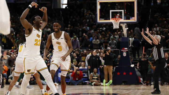 Mar 16, 2025; Washington, D.C., USA; VCU Rams players celebrate prior to 0.5 seconds being added back onto the clock against the George Mason Patriots in the second half at Capital One Arena. Mandatory Credit: Geoff Burke-Imagn Images