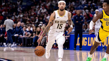 Jose Alvarado dribbles the basketball