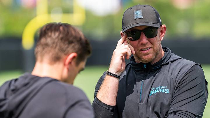 Jacksonville Jaguars general manager James Gladstone, left, talks with Jacksonville Jaguars head coach Liam Coen, right, after the. Jacksonville Jaguars’ mandatory minicamp Tuesday June 10, 2025 at the Miller Electric Center in Jacksonville, Fla. 