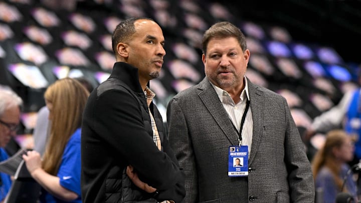 Mar 9, 2025; Dallas, Texas, USA; Dallas Mavericks general manager Nico Harrison (left) speaks with reporter Marc Stein (right) before the game between the Dallas Mavericks and the Phoenix Suns at the American Airlines Center. Mandatory Credit: Jerome Miron-Imagn Images