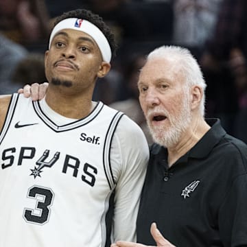 November 24, 2023; San Francisco, California, USA; San Antonio Spurs head coach Gregg Popovich (Right) talks to forward Keldon Johnson (3) during the third quarter against the Golden State Warriors at Chase Center. Mandatory Credit: Kyle Terada-Imagn Images