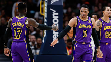 Jan 9, 2023; Denver, Colorado, USA; Los Angeles Lakers guard Russell Westbrook (0) reacts with guard Dennis Schroder (17) in the fourth quarter against the Denver Nuggets at Ball Arena. Mandatory Credit: Isaiah J. Downing-Imagn Images