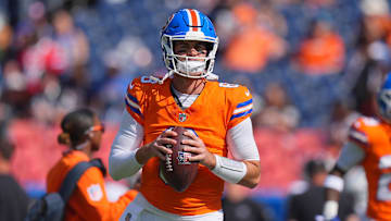 Oct 6, 2024; Denver, Colorado, USA; Denver Broncos quarterback Jarrett Stidham (8) warms up before the game against the Las Vegas Raiders at Empower Field at Mile High. Mandatory Credit: Ron Chenoy-Imagn Images
